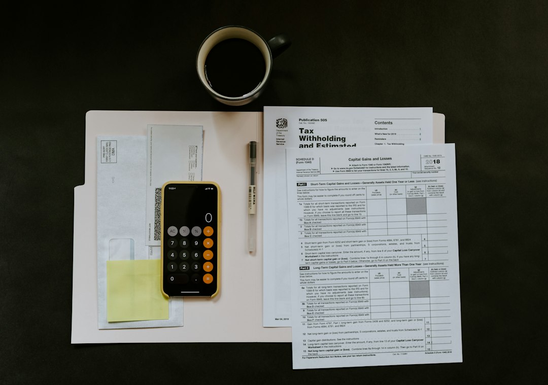 Tax forms and calculator illustration for Ghana Revenue Authority announcement; photo by Kelly Sikkema